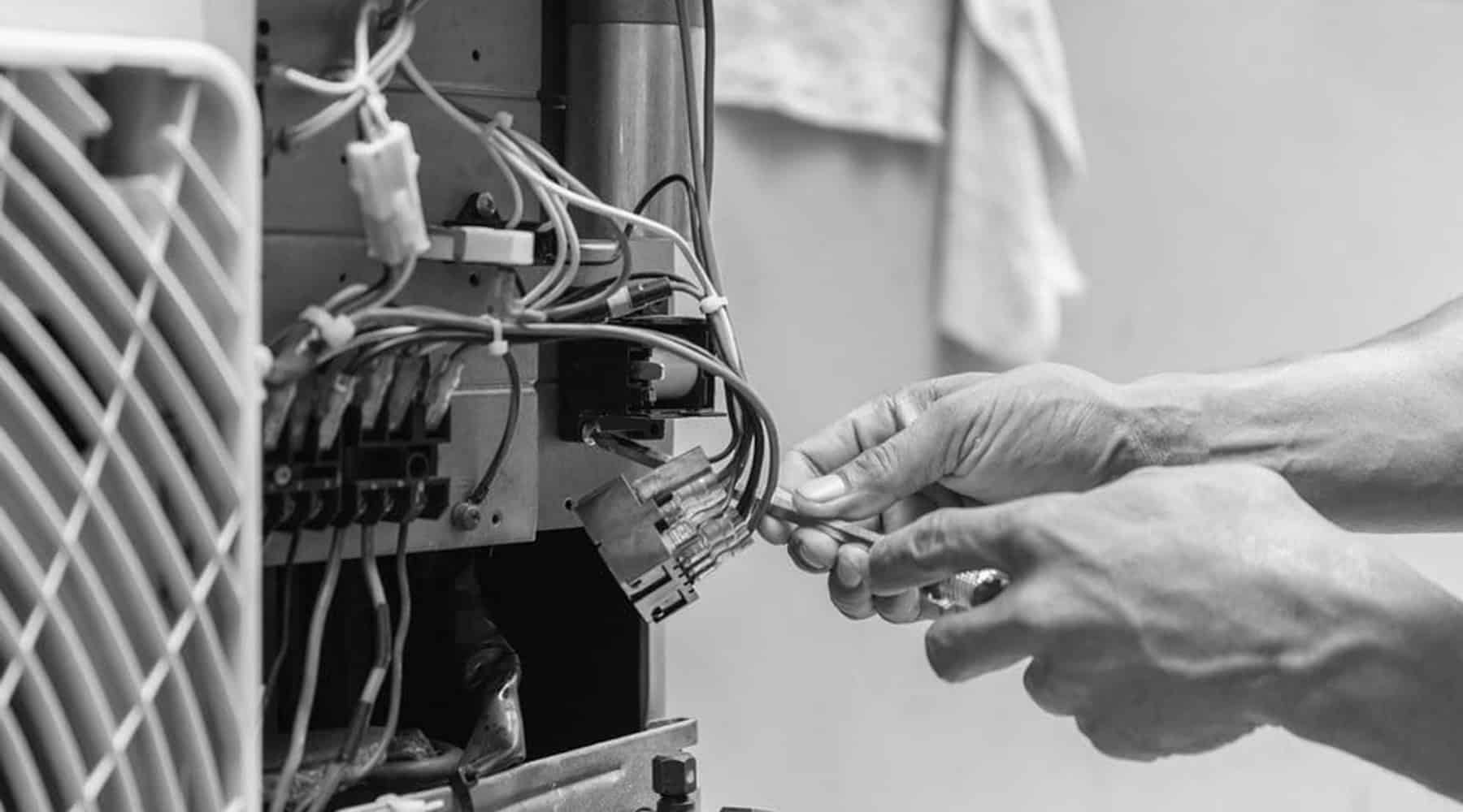 close of tech fixing a furnace