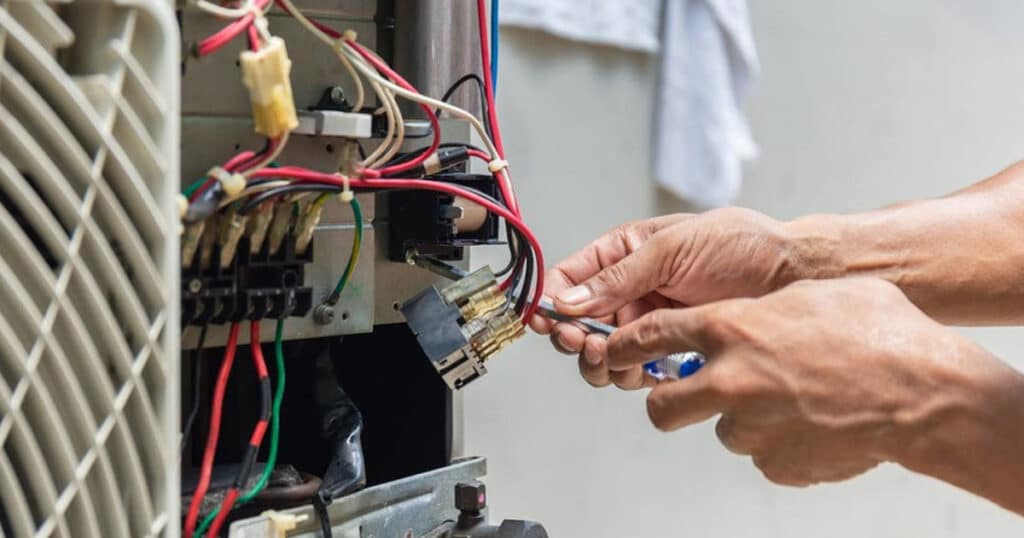 close of tech fixing a furnace