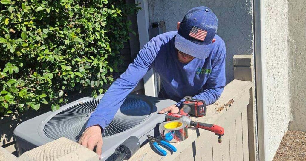 Airtime tech doing maintenance ac unit